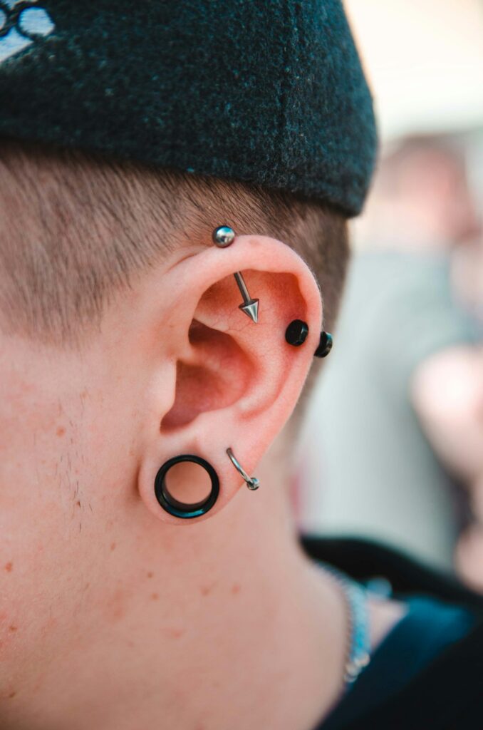 person wearing stud earrings