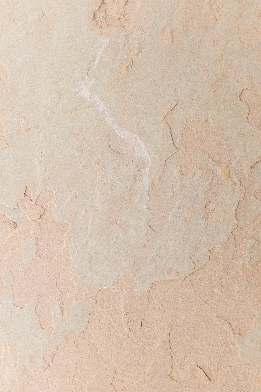 a close up of a wall with some paint on it