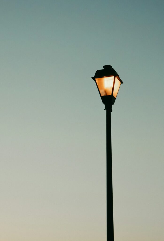 lighted black and orange lamp post