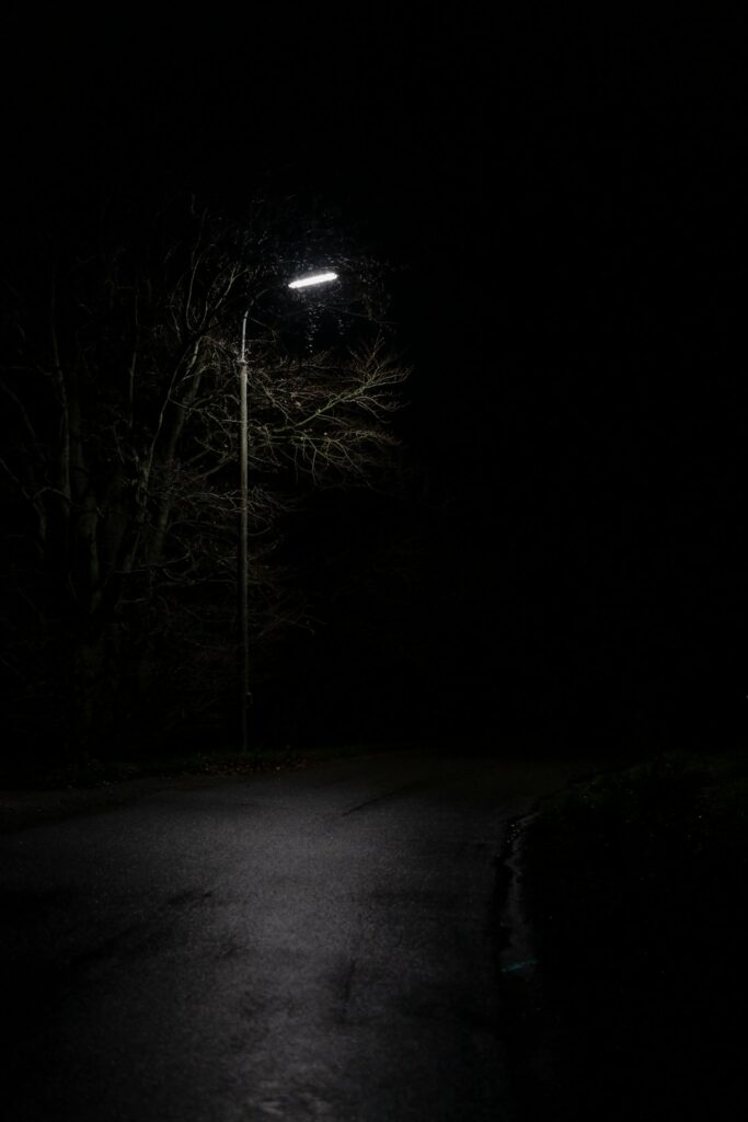 view of empty road under light post