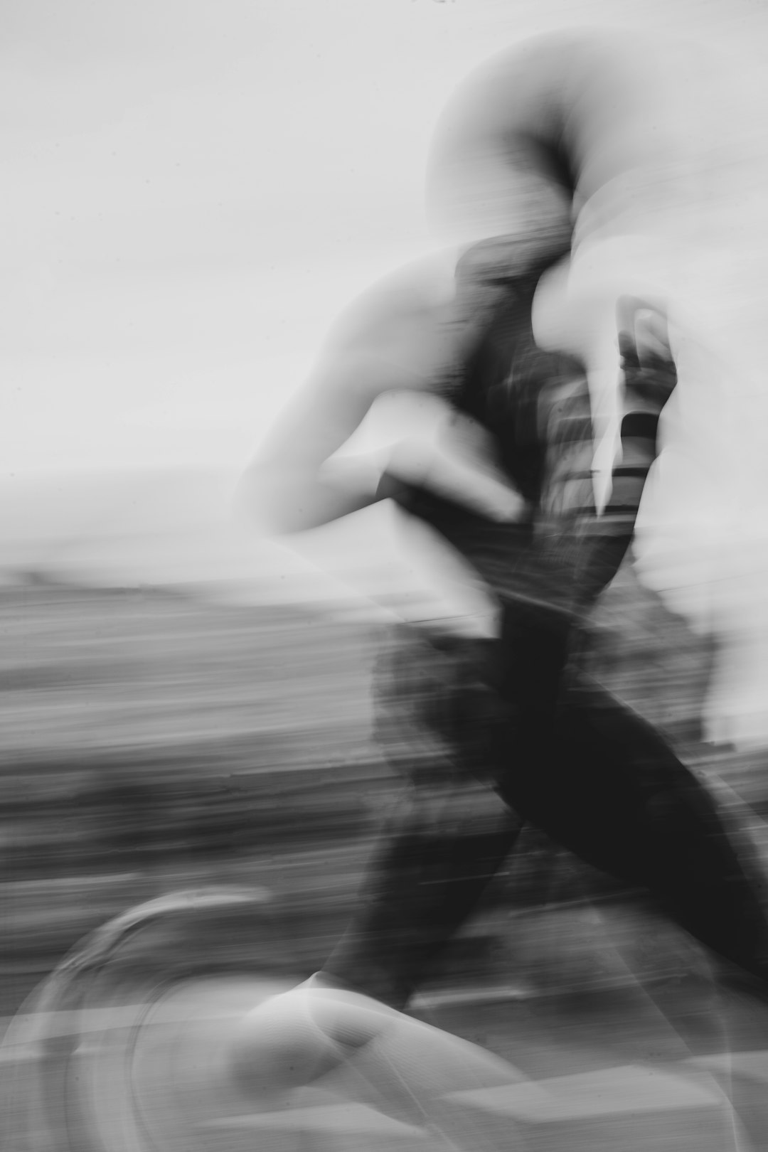 A blurred person is riding a bicycle
